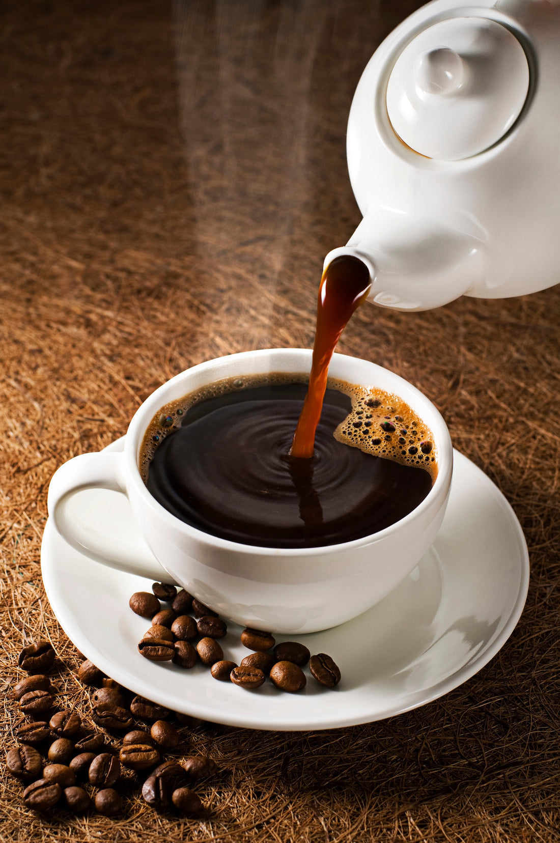 white coffee cup and pot with coffee