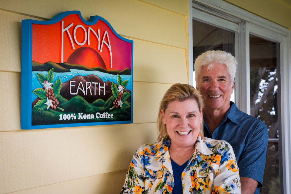 Steve and Joanie Wynn stand in front of Kona Earth sign