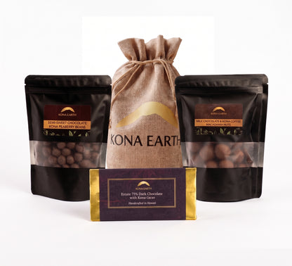 A chocolate gift set from Kona Earth, featuring two black stand-up pouches of chocolate beans (one with dark berry chocolate and one with earthy chocolate), a central tan burlap drawstring bag, and a dark purple chocolate bar with gold trim in front, all on a white background.